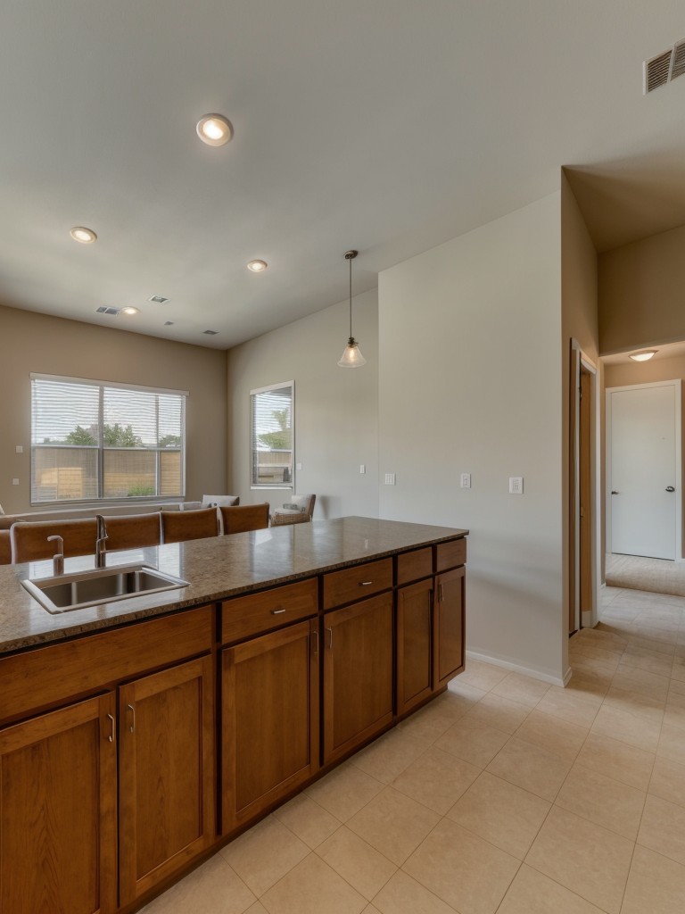 Open concept floor plan with a spacious living area, kitchenette, and separate bedroom for privacy.